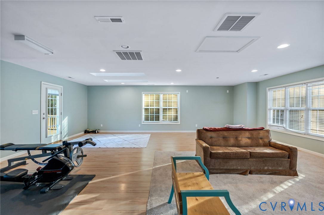 338 Thessalonia Road Bremo Bluff, VA 23022 - Photo 35 of 50 a living room with furniture a window and gym equipment