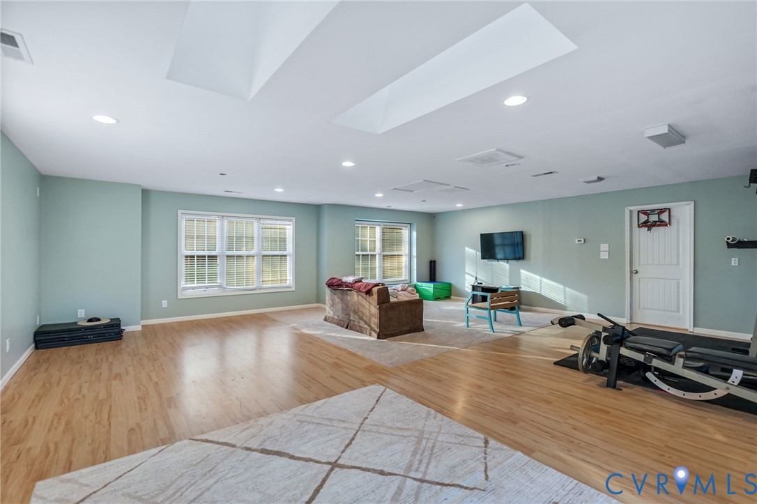 338 Thessalonia Road Bremo Bluff, VA 23022 - Photo 37 of 50 a living room with furniture and a wooden floor