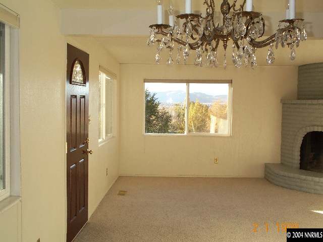 8825 Paloma Way Reno, NV 89506 - Photo 3 of 9 a view of a livingroom with a chandelier