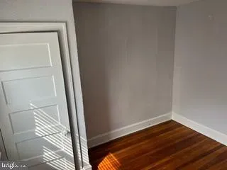 a room with wooden floor and small space