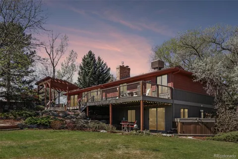 a view of house with yard and green space
