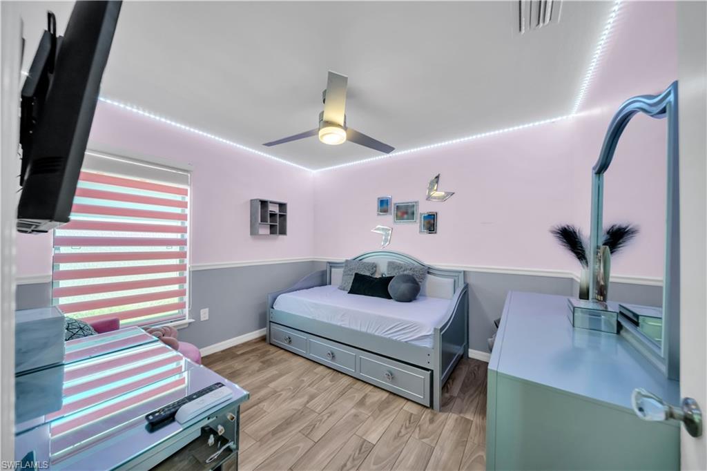 175 Shadowview Court Lehigh Acres, FL 33974 - Photo 31 of 39 Bedroom featuring light wood-style floors and ceiling fan