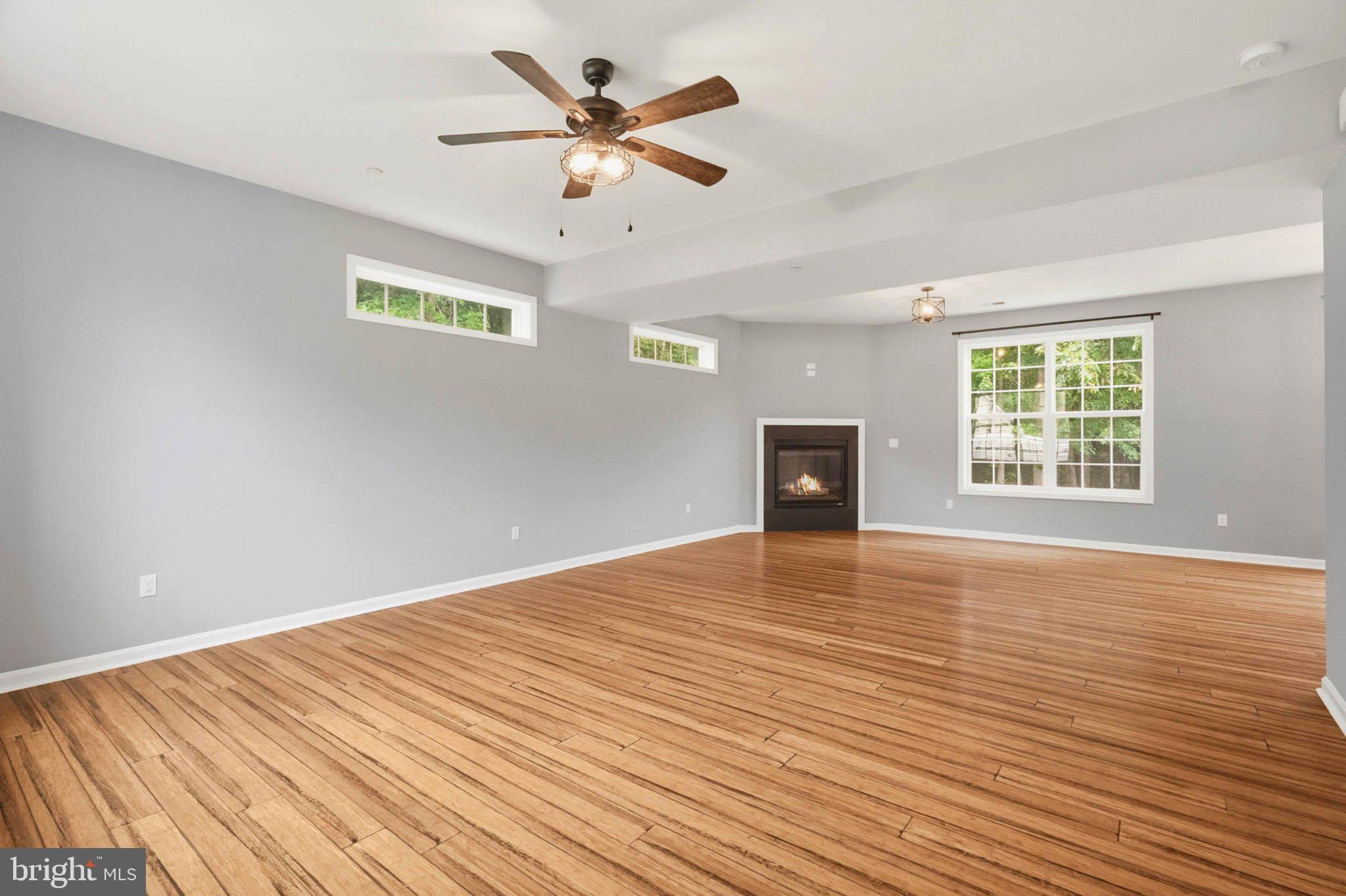 706 Trapper Way Deale, MD 20751 - Photo 14 of 61 Spacious room with warm wood floors.