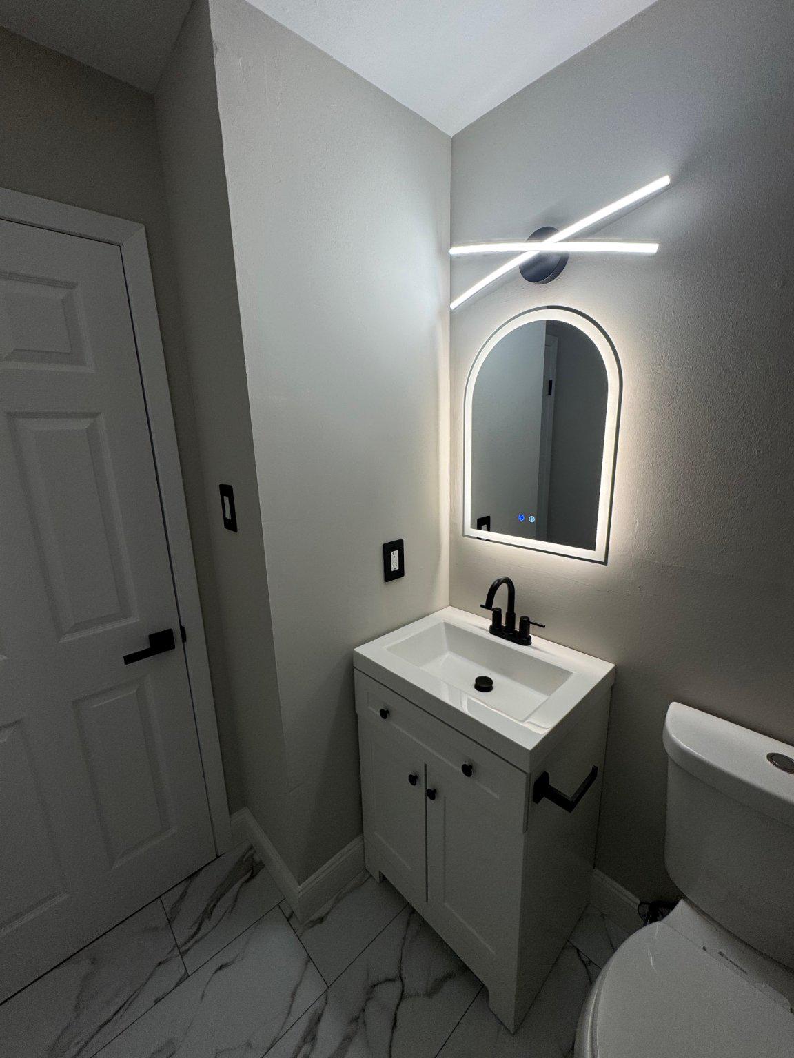 8 Framingham Road Beverly, NJ 08010 - Photo 30 of 35 a bathroom with a toilet sink and mirror