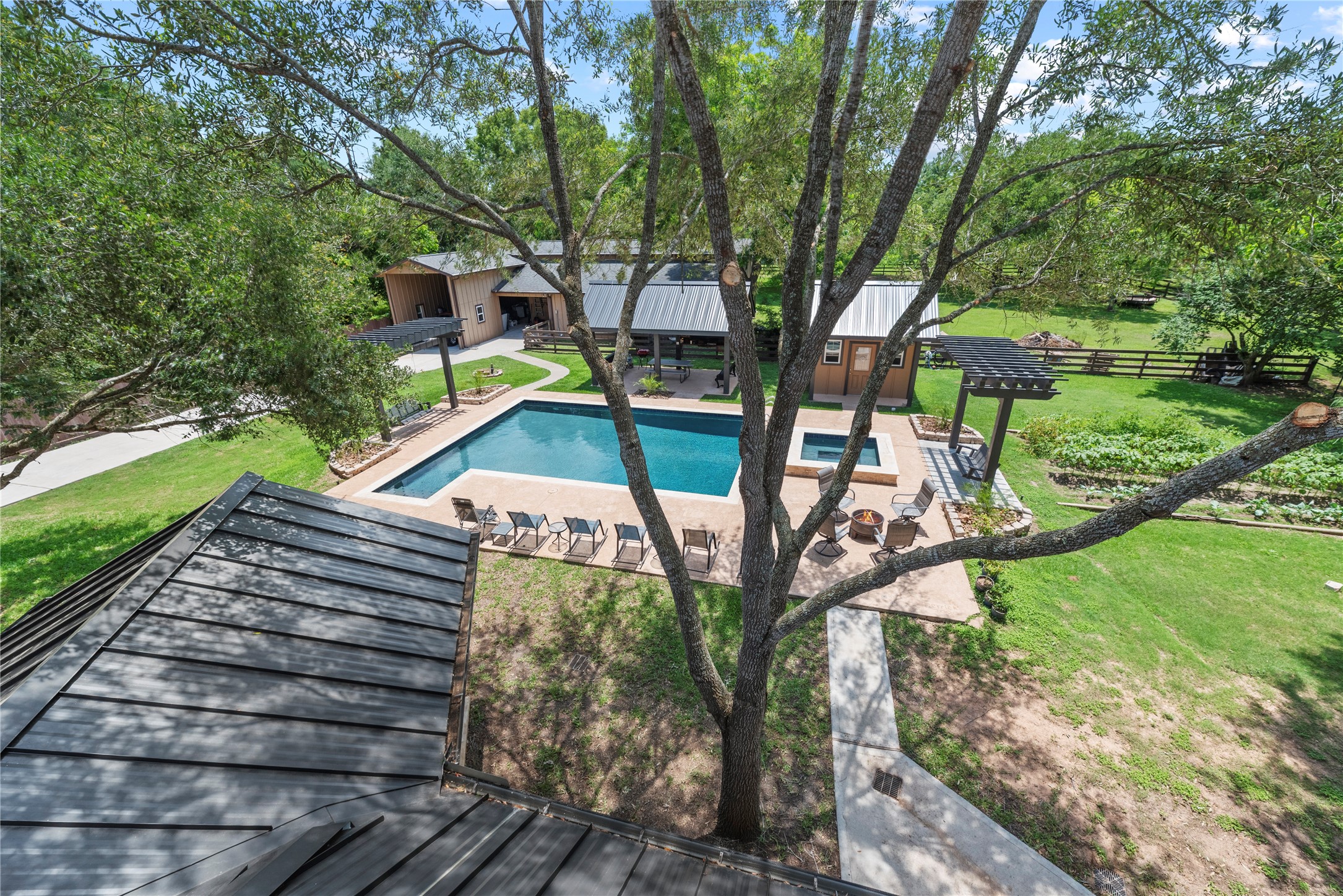 4607 Clayhead Road Richmond, TX 77406 - Photo 36 of 49 Sweeping aerial perspective highlighting the luxury pool, manicured acreage, and exceptional outdoor living spaces.