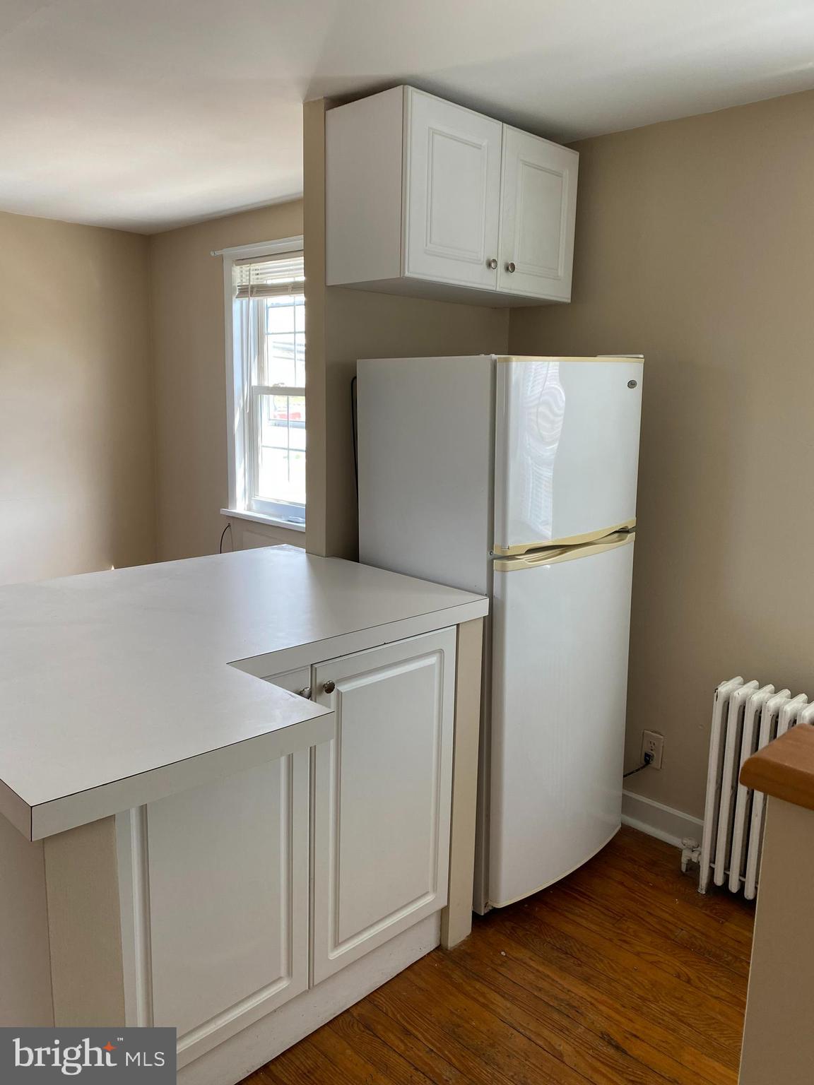 2185 Kimberton Road Phoenixville, PA 19460 - Photo 5 of 15 a kitchen with cabinets and wooden floor