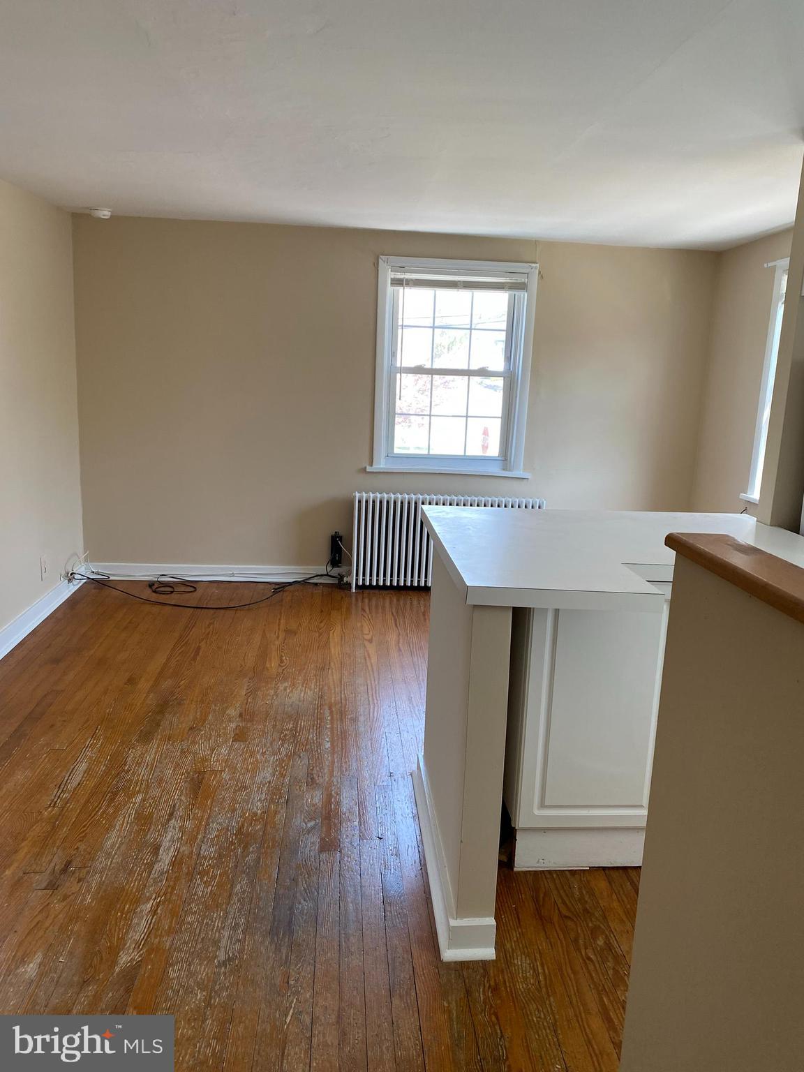 2185 Kimberton Road Phoenixville, PA 19460 - Photo 6 of 15 an empty room with wooden floor and windows
