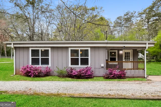 front view of a house with a yard