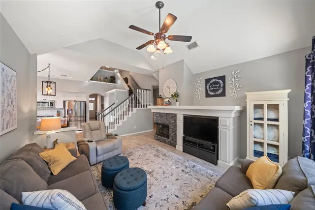 a living room with furniture and a fireplace
