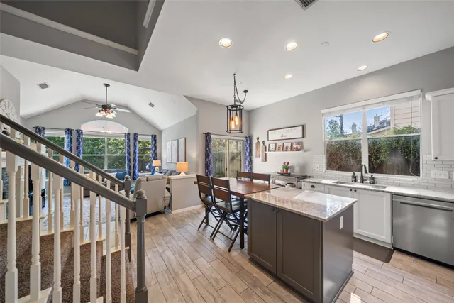a very nice looking dining room with a large window