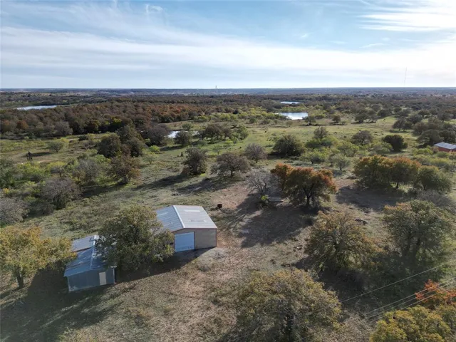 an aerial view of residential house with outdoor space