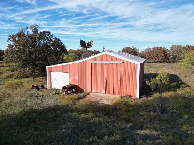 an aerial view of houses covered with fog