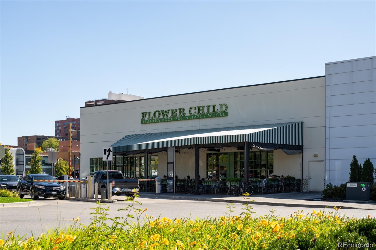 538 Madison Street Denver, CO 80206 - Photo 11 of 12 a view of a building with a sitting area
