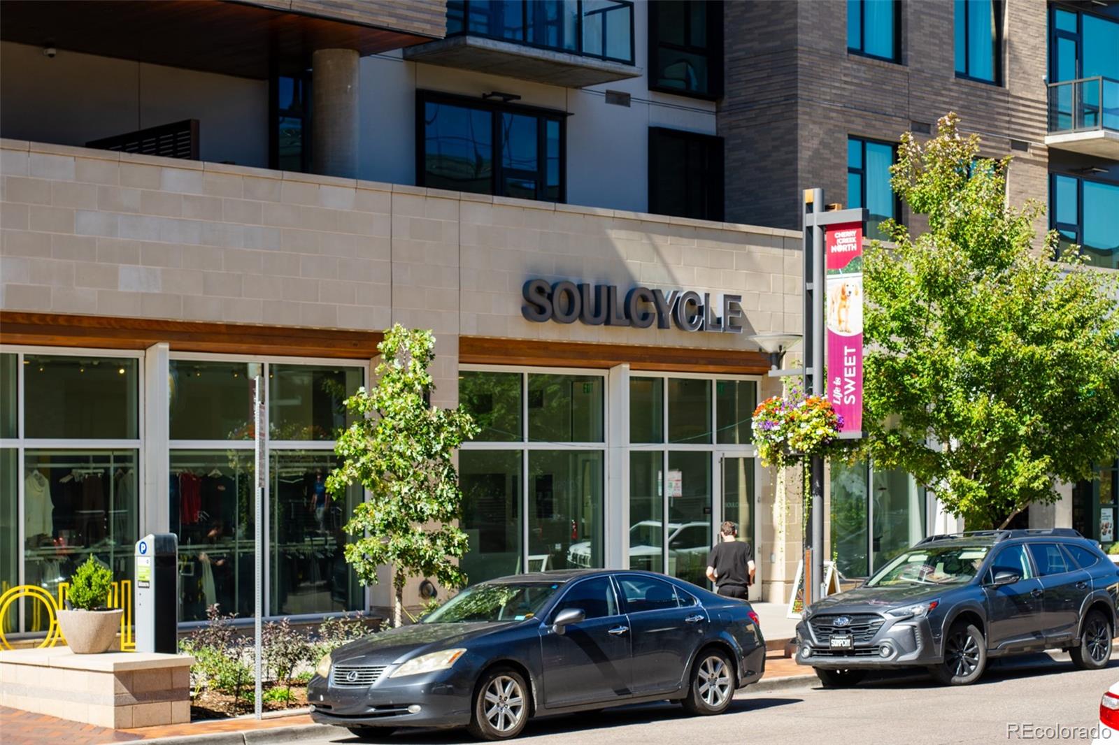 538 Madison Street Denver, CO 80206 - Photo 12 of 12 a car parked in front of a building