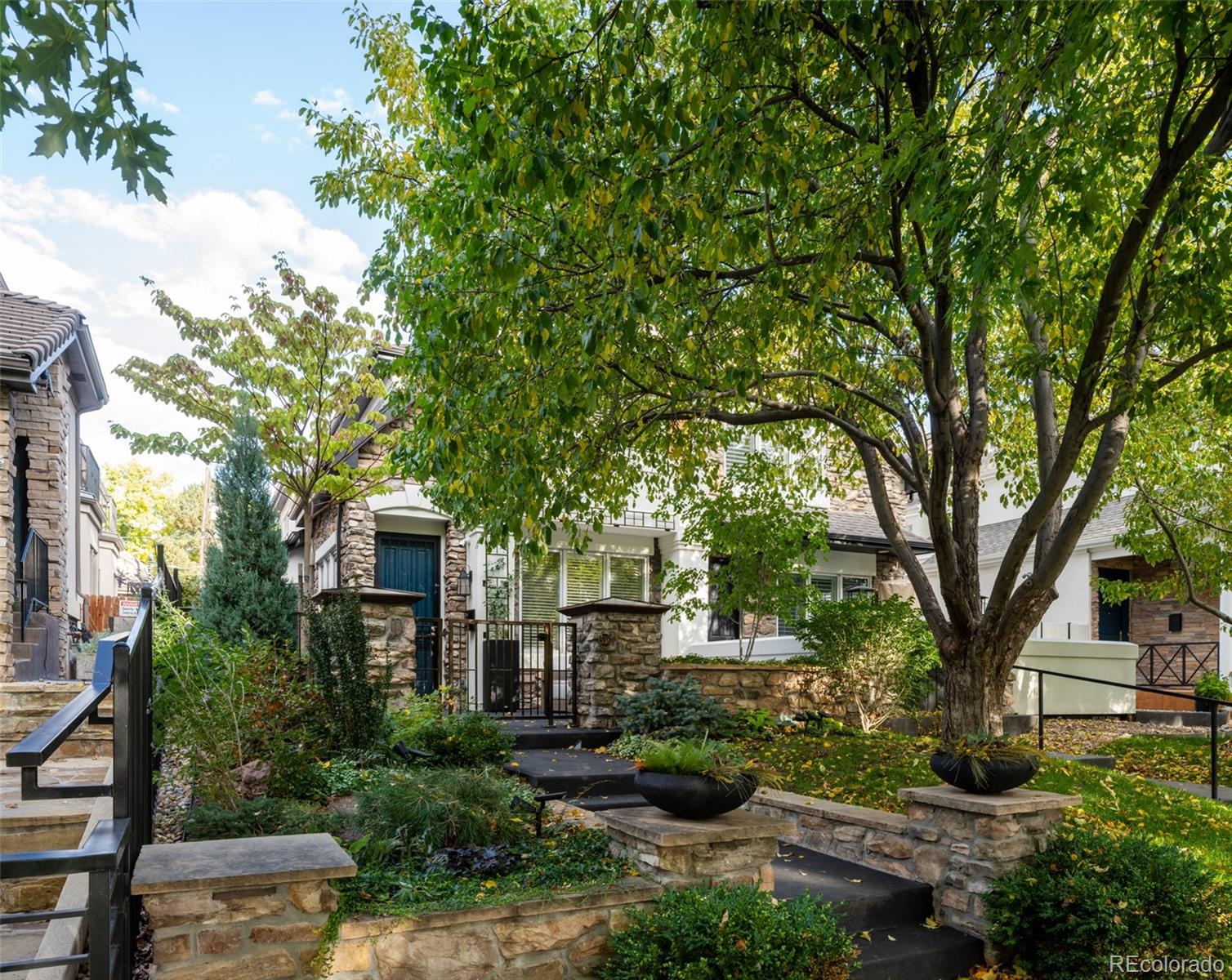538 Madison Street Denver, CO 80206 - Photo 2 of 12 a front view of a house with a yard