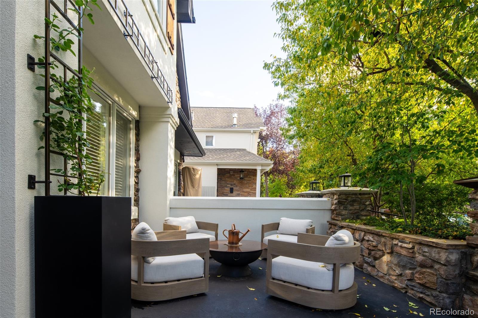 538 Madison Street Denver, CO 80206 - Photo 4 of 12 a building outdoor space with patio furniture