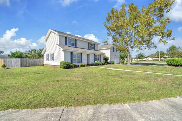 a view of a swimming pool with an outdoor seating