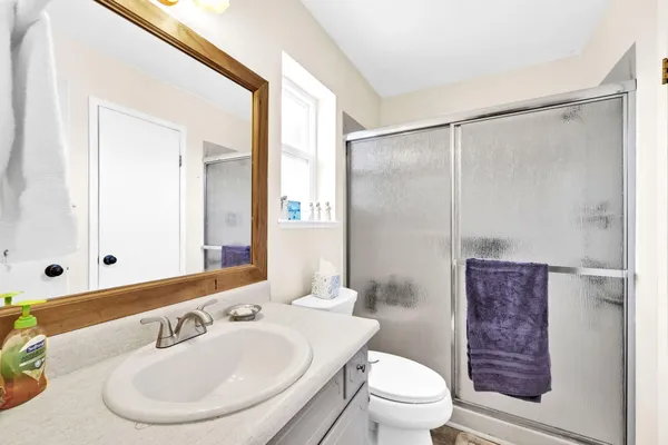 a bathroom with a sink double vanity and a mirror