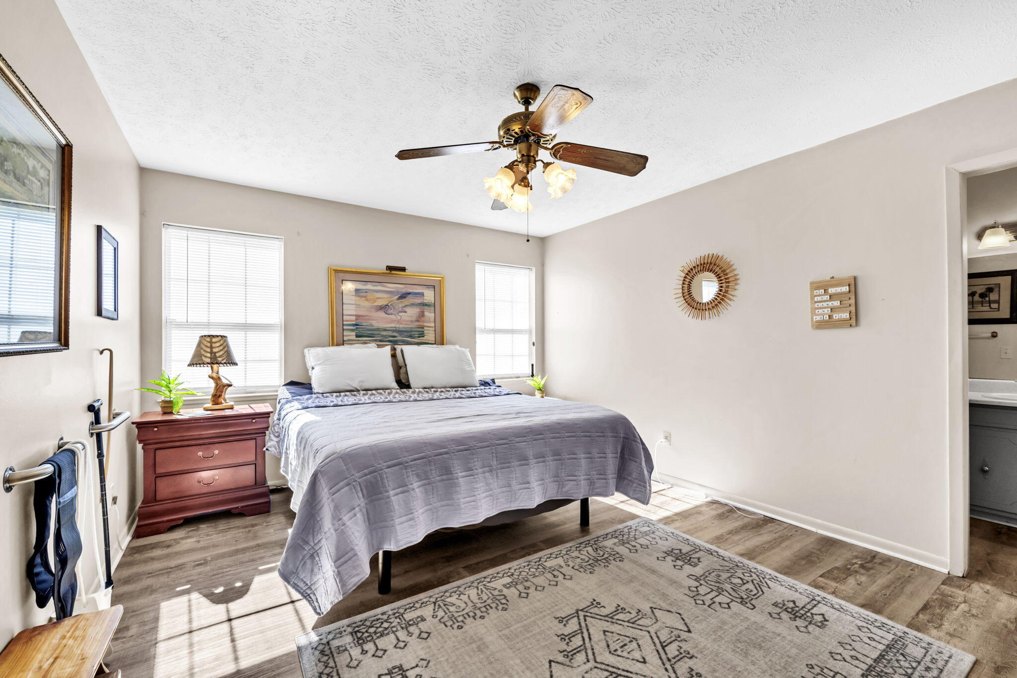 2609 Briarcliff Road Panama City, FL 32405 - Photo 23 of 41 a bedroom with a bed and wooden floor