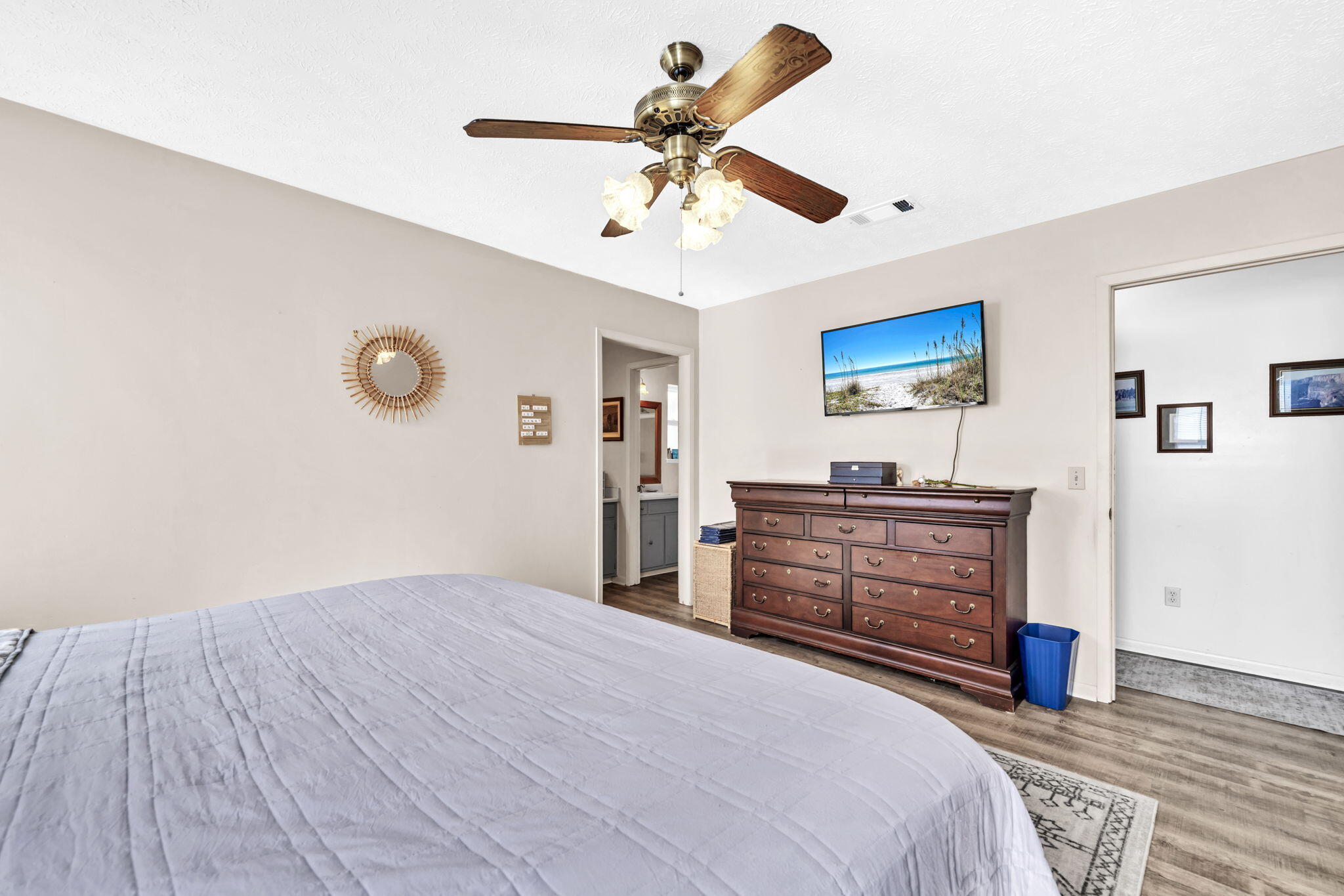 2609 Briarcliff Road Panama City, FL 32405 - Photo 24 of 41 a bedroom with a bed and a chandelier