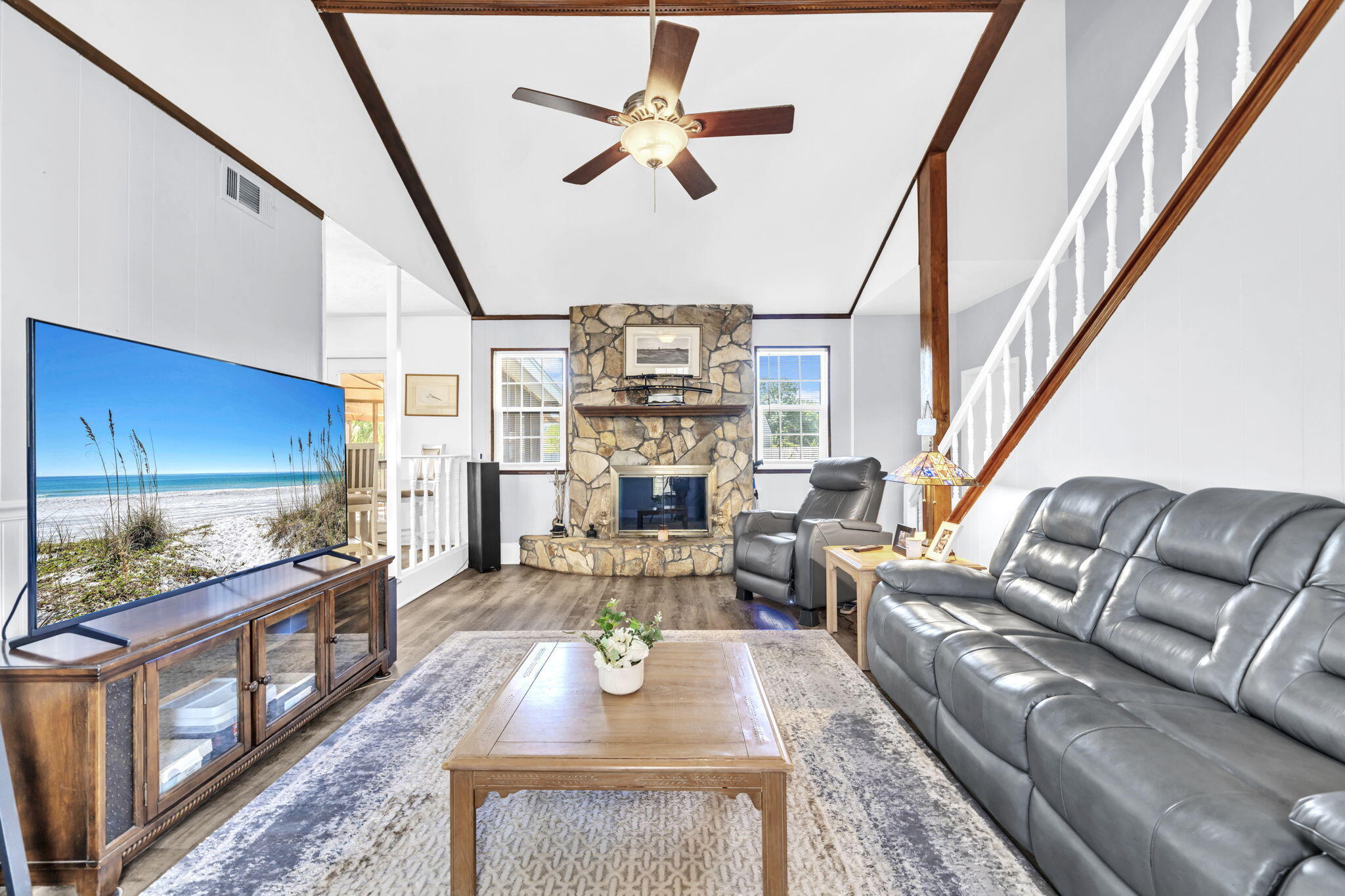 2609 Briarcliff Road Panama City, FL 32405 - Photo 26 of 41 a living room with furniture fireplace and a flat screen tv
