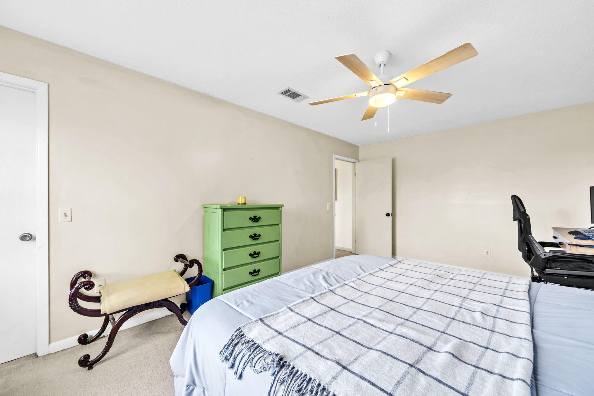 2609 Briarcliff Road Panama City, FL 32405 - Photo 32 of 41 a bedroom with a bed and a chandelier