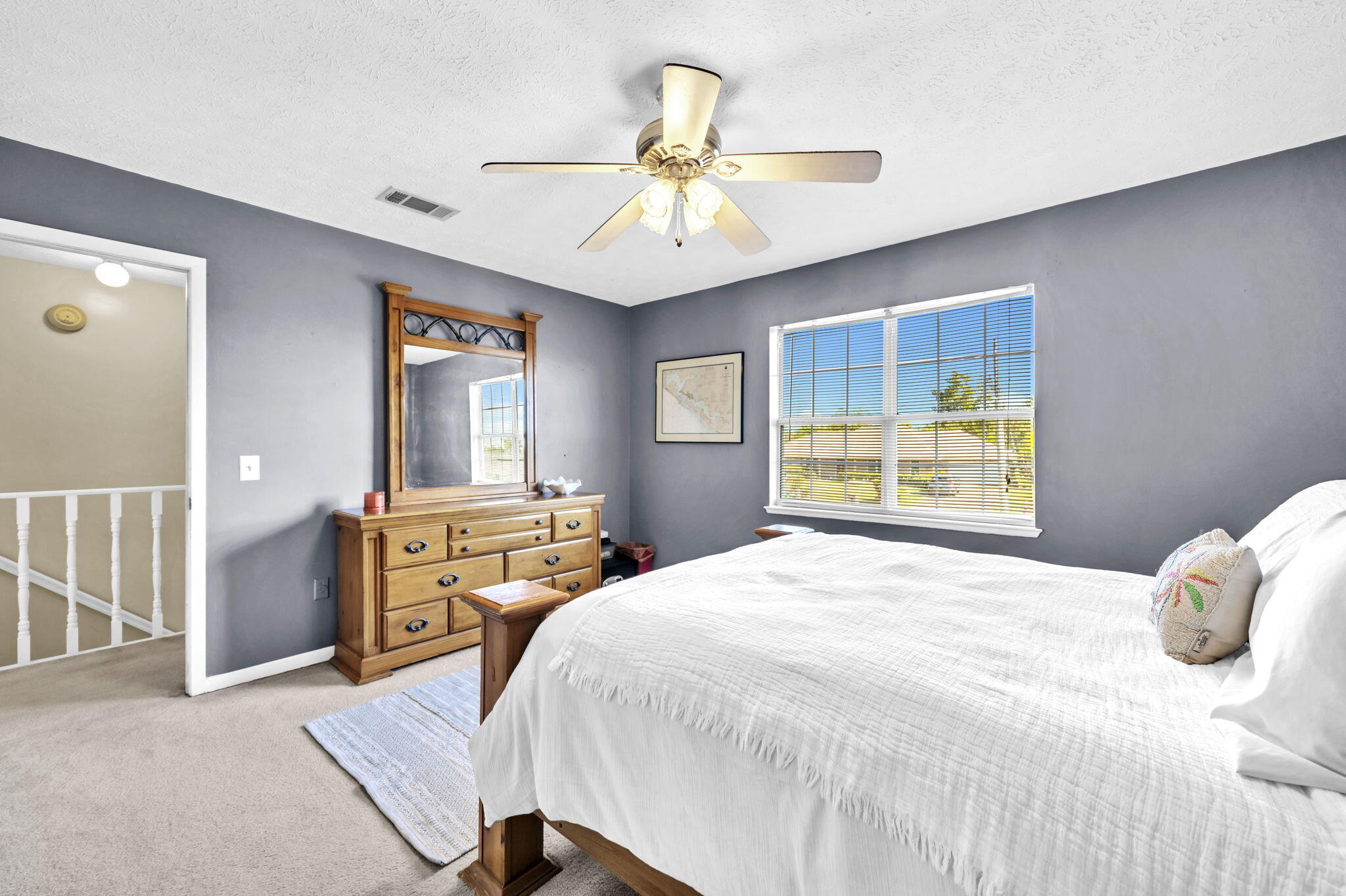 2609 Briarcliff Road Panama City, FL 32405 - Photo 35 of 41 a bedroom with a bed and a chandelier