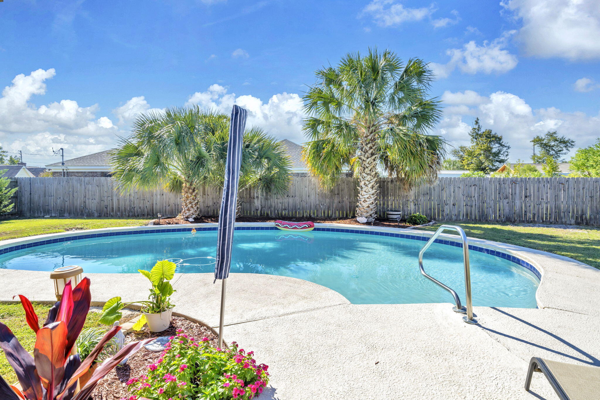2609 Briarcliff Road Panama City, FL 32405 - Photo 37 of 41 a view of a swimming pool with a lounge chairs