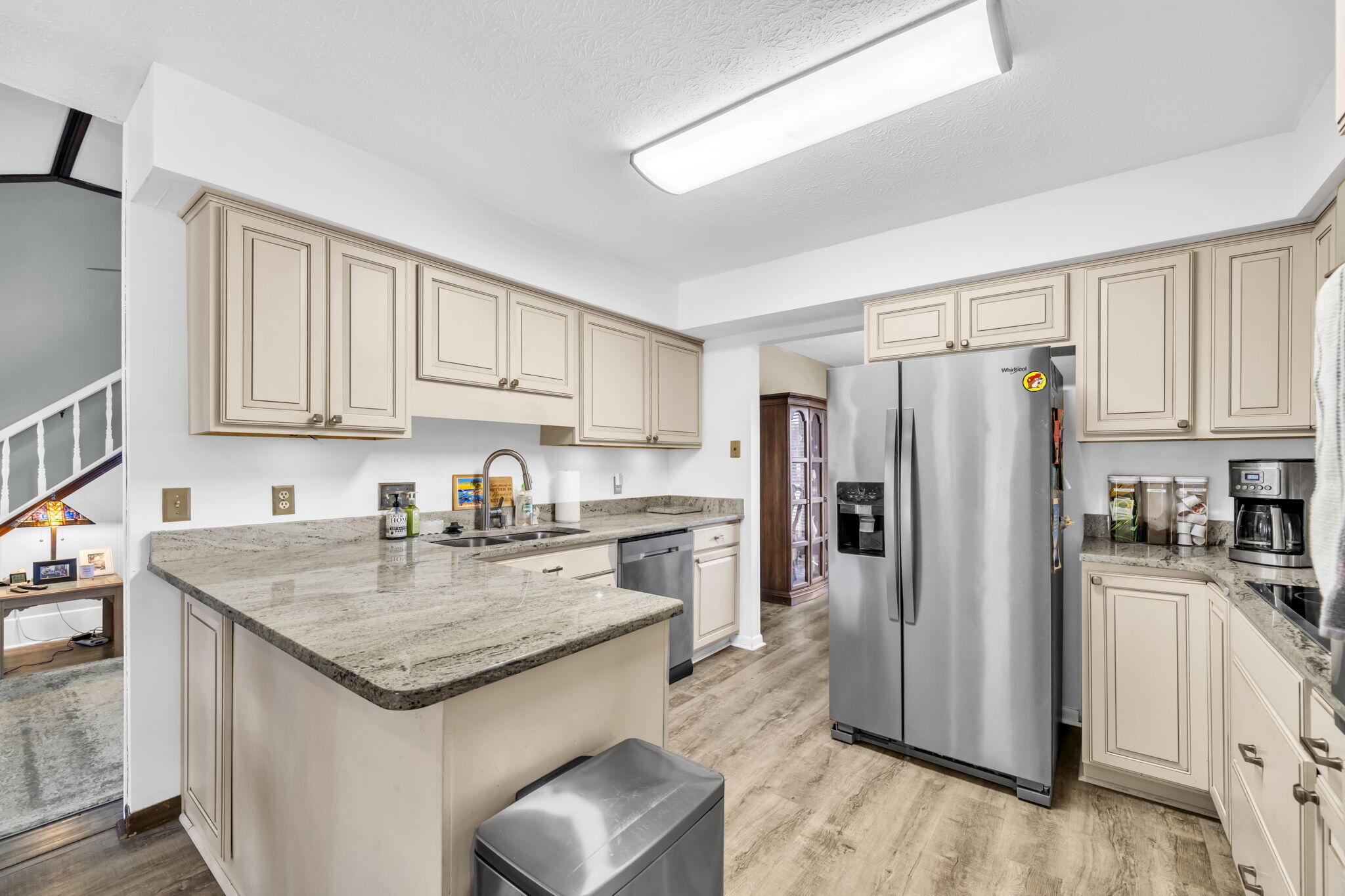 2609 Briarcliff Road Panama City, FL 32405 - Photo 5 of 41 a kitchen with a refrigerator a stove a sink and white cabinets