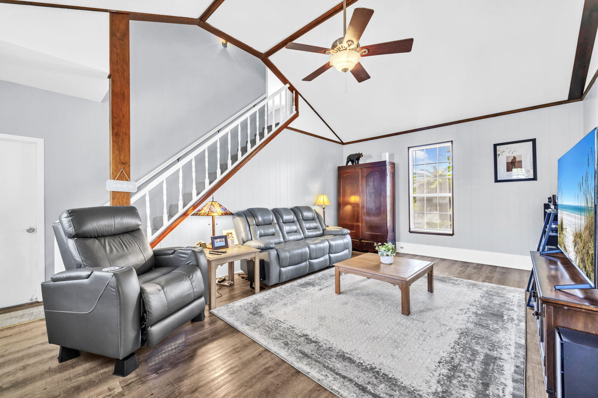 2609 Briarcliff Road Panama City, FL 32405 - Photo 7 of 41 a living room with couches and kitchen view with wooden floor