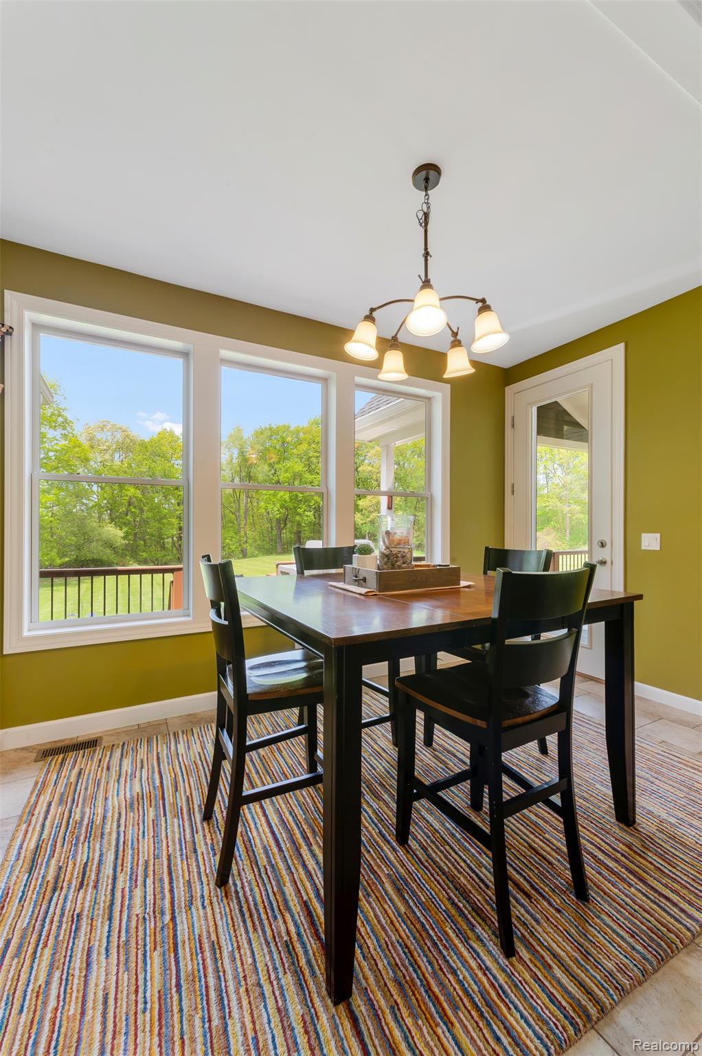 13085 Rohn Road Fenton, MI 48430 - Photo 14 of 52 Dining space with suspended lighting and baseboards