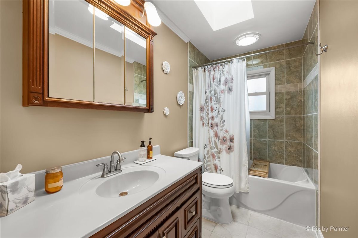 647 North Ridgemoor Avenue Mundelein, IL 60060 - Photo 21 of 39 a bathroom with a granite countertop sink toilet and shower