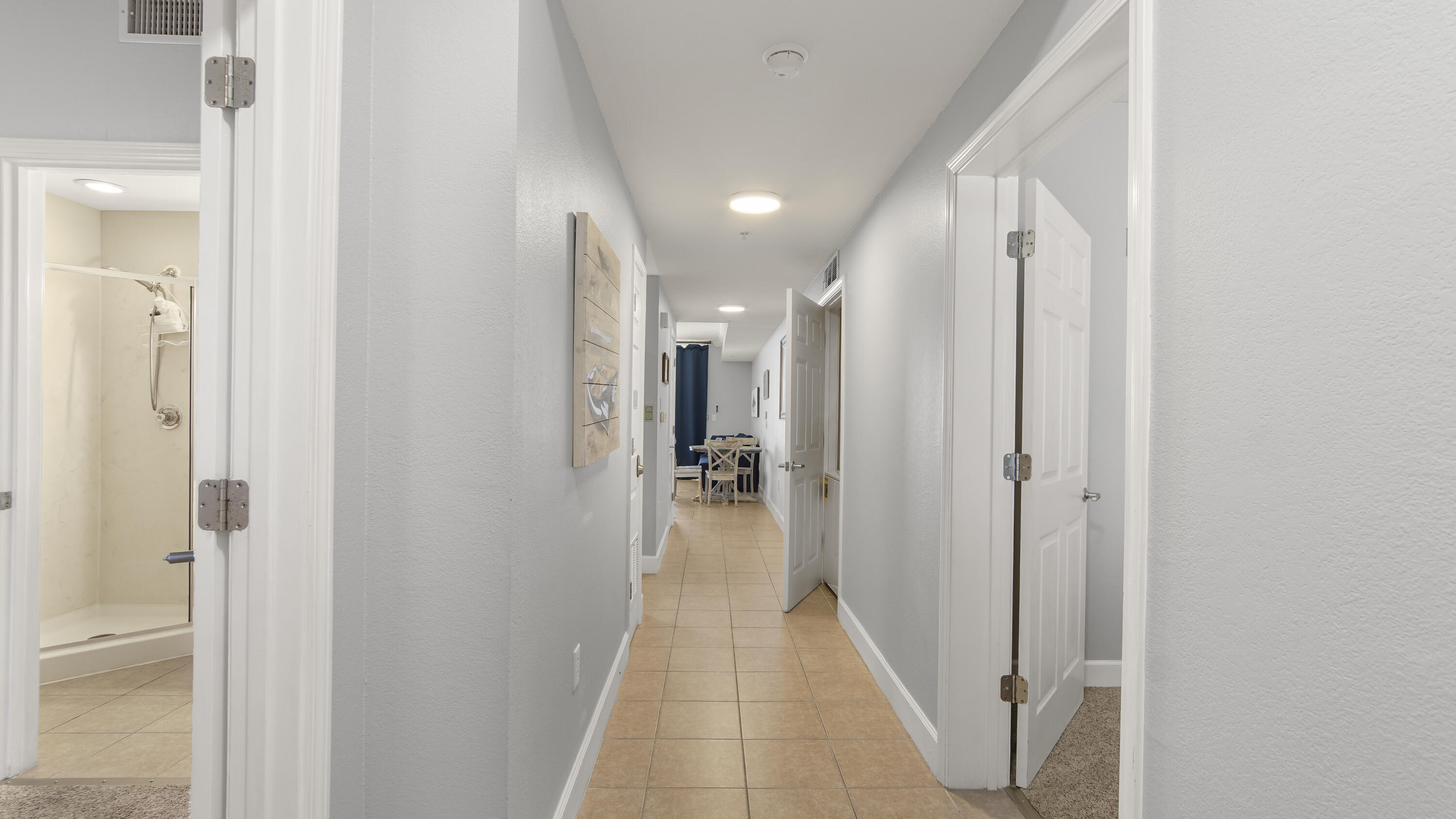 16819 Front Beach Road, Unit 1810 Panama City Beach, FL 32413 - Photo 20 of 54 a view of a hallway with a hallway and a room