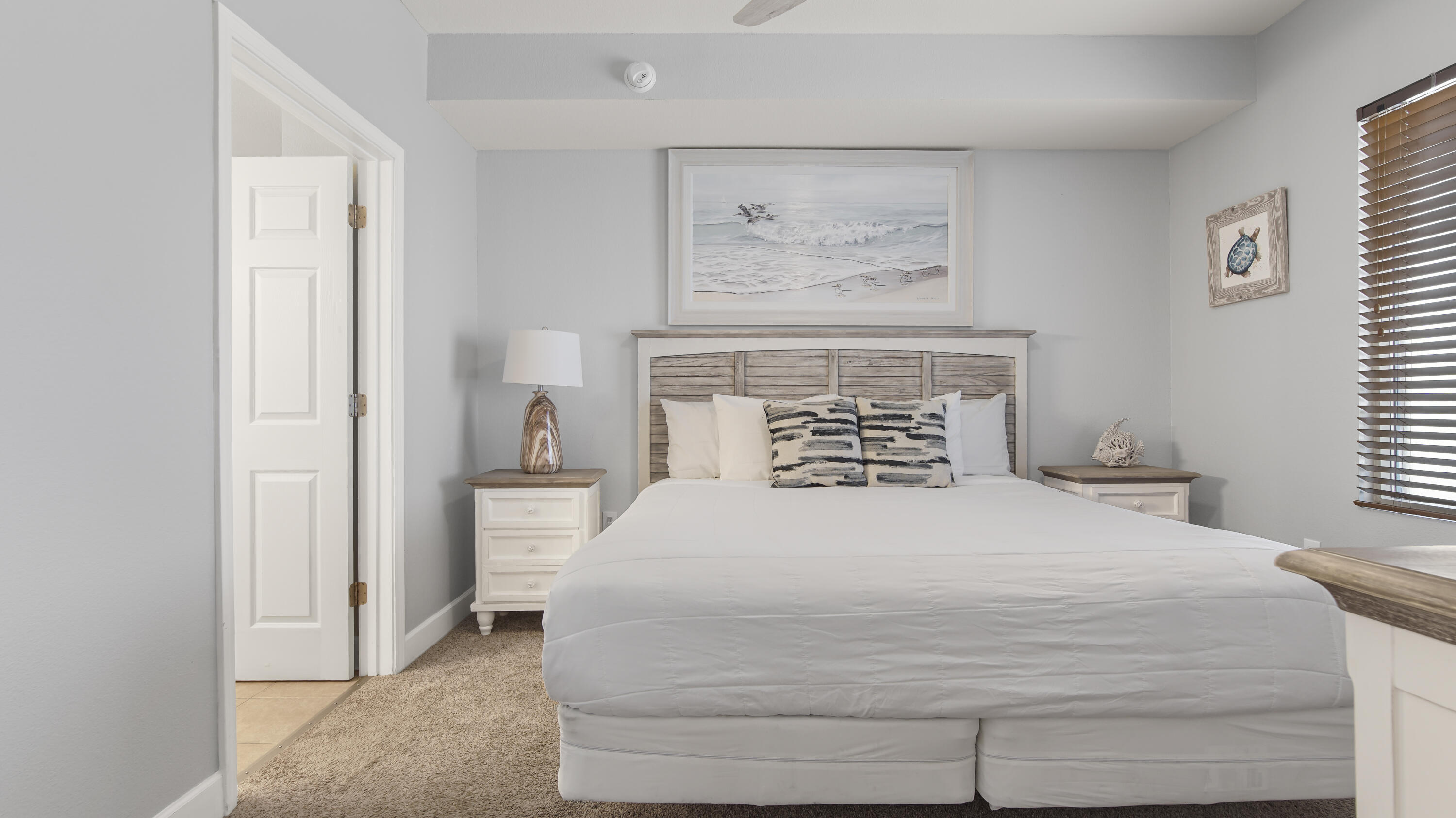 16819 Front Beach Road, Unit 1810 Panama City Beach, FL 32413 - Photo 26 of 54 a bedroom with a bed and a painting