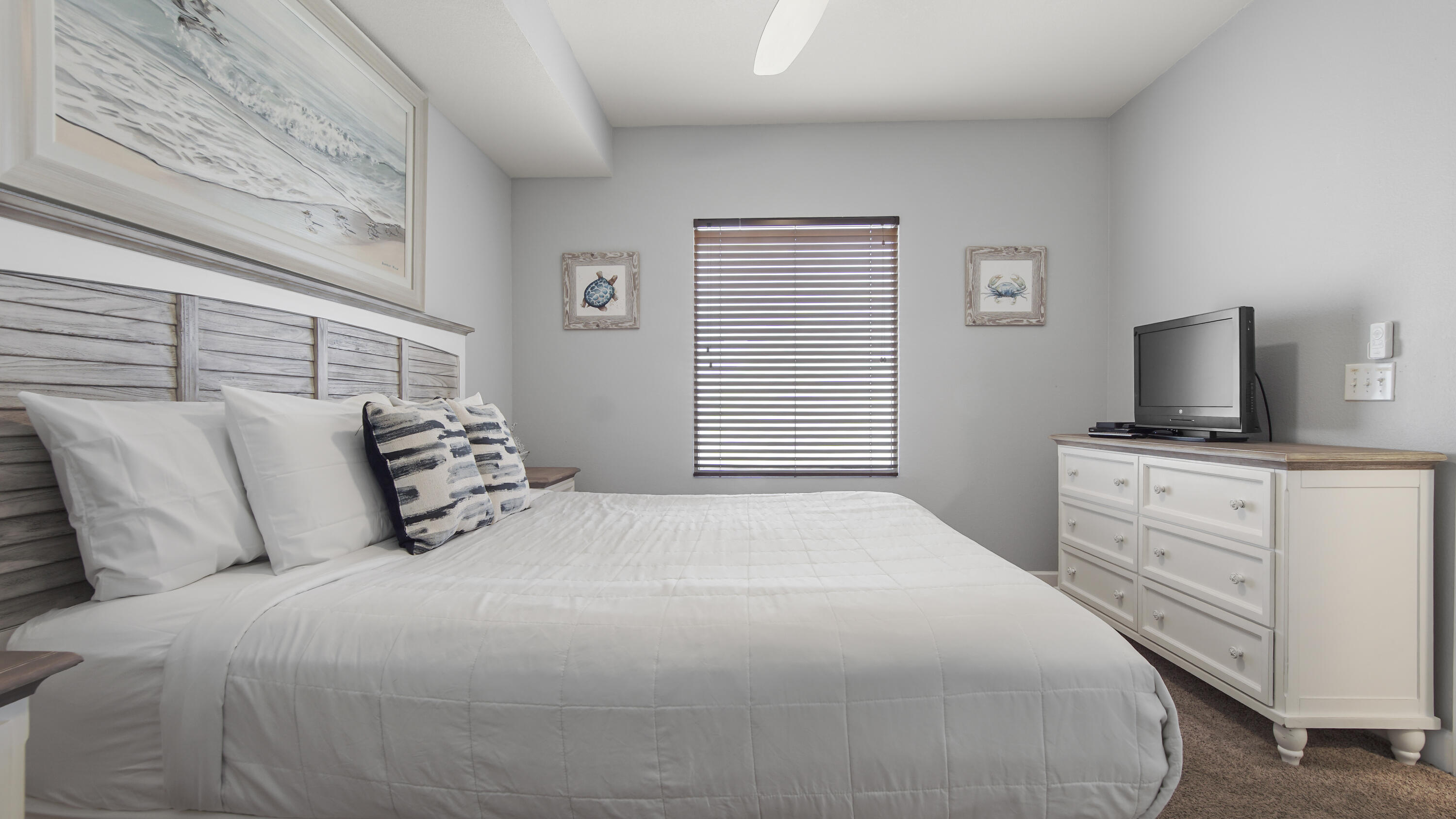 16819 Front Beach Road, Unit 1810 Panama City Beach, FL 32413 - Photo 28 of 54 a bedroom with a bed and flat screen tv