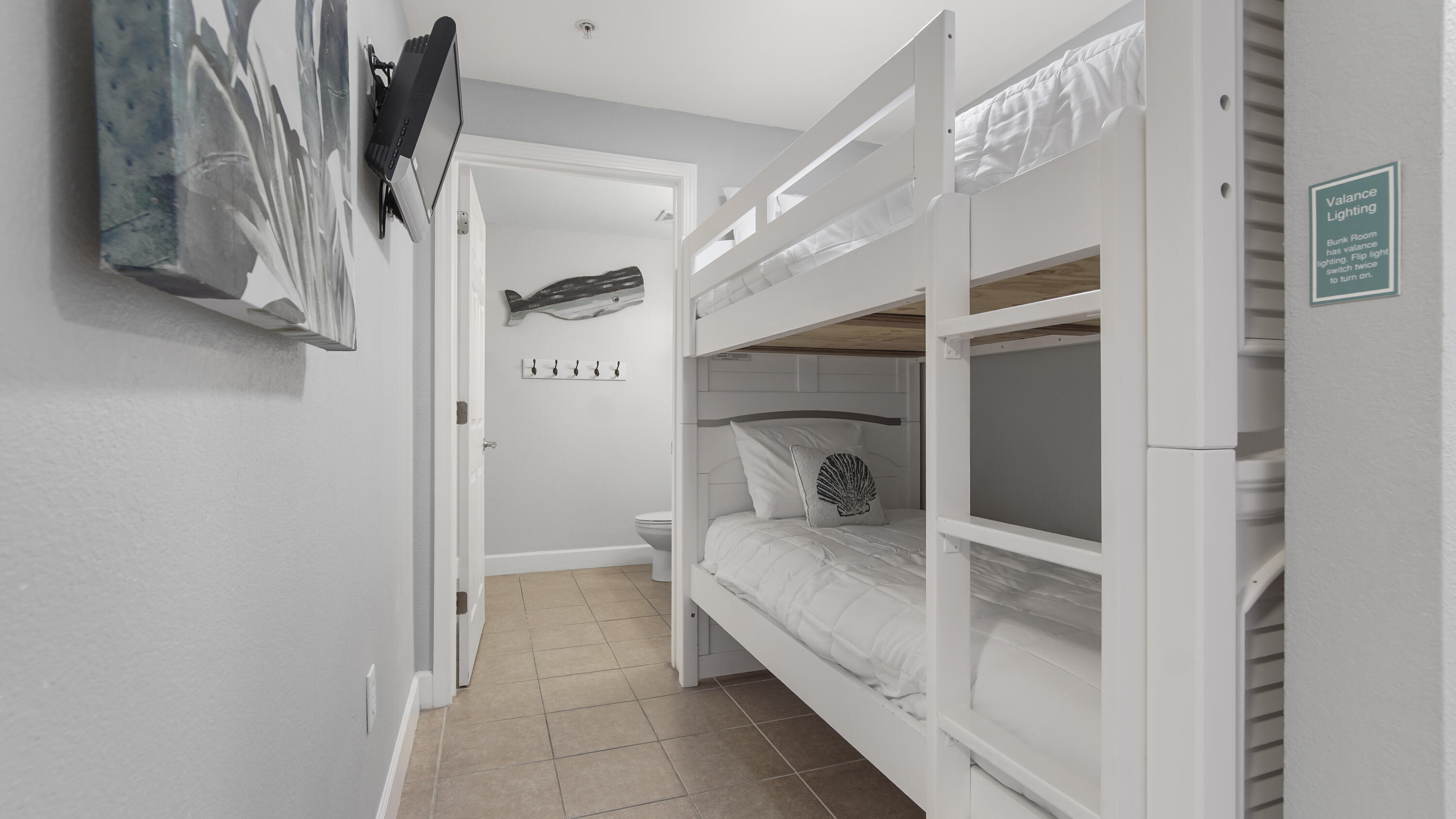 16819 Front Beach Road, Unit 1810 Panama City Beach, FL 32413 - Photo 32 of 54 a bathroom with a sink and a mirror