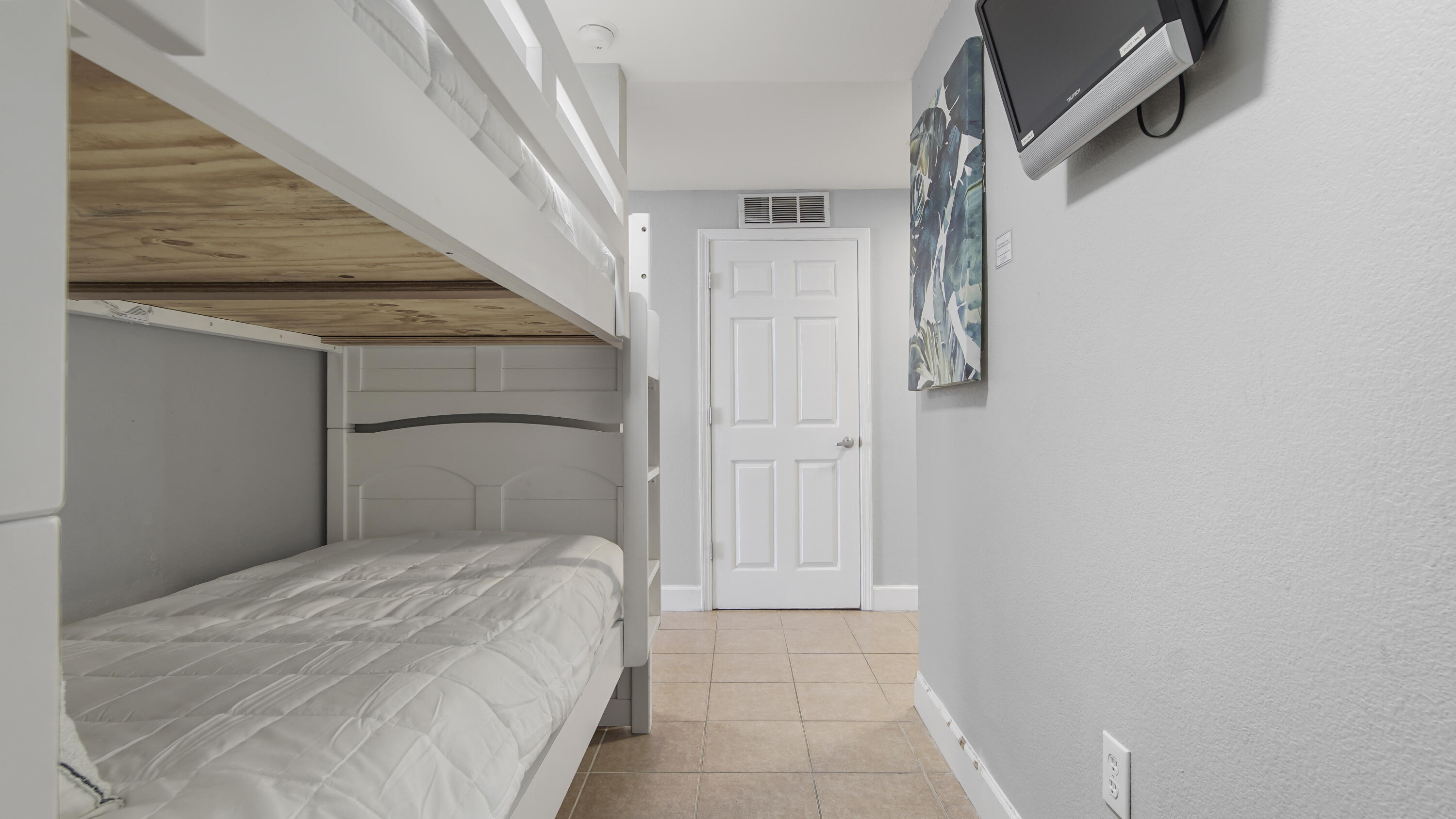 16819 Front Beach Road, Unit 1810 Panama City Beach, FL 32413 - Photo 36 of 54 a bedroom with a bed and a shower