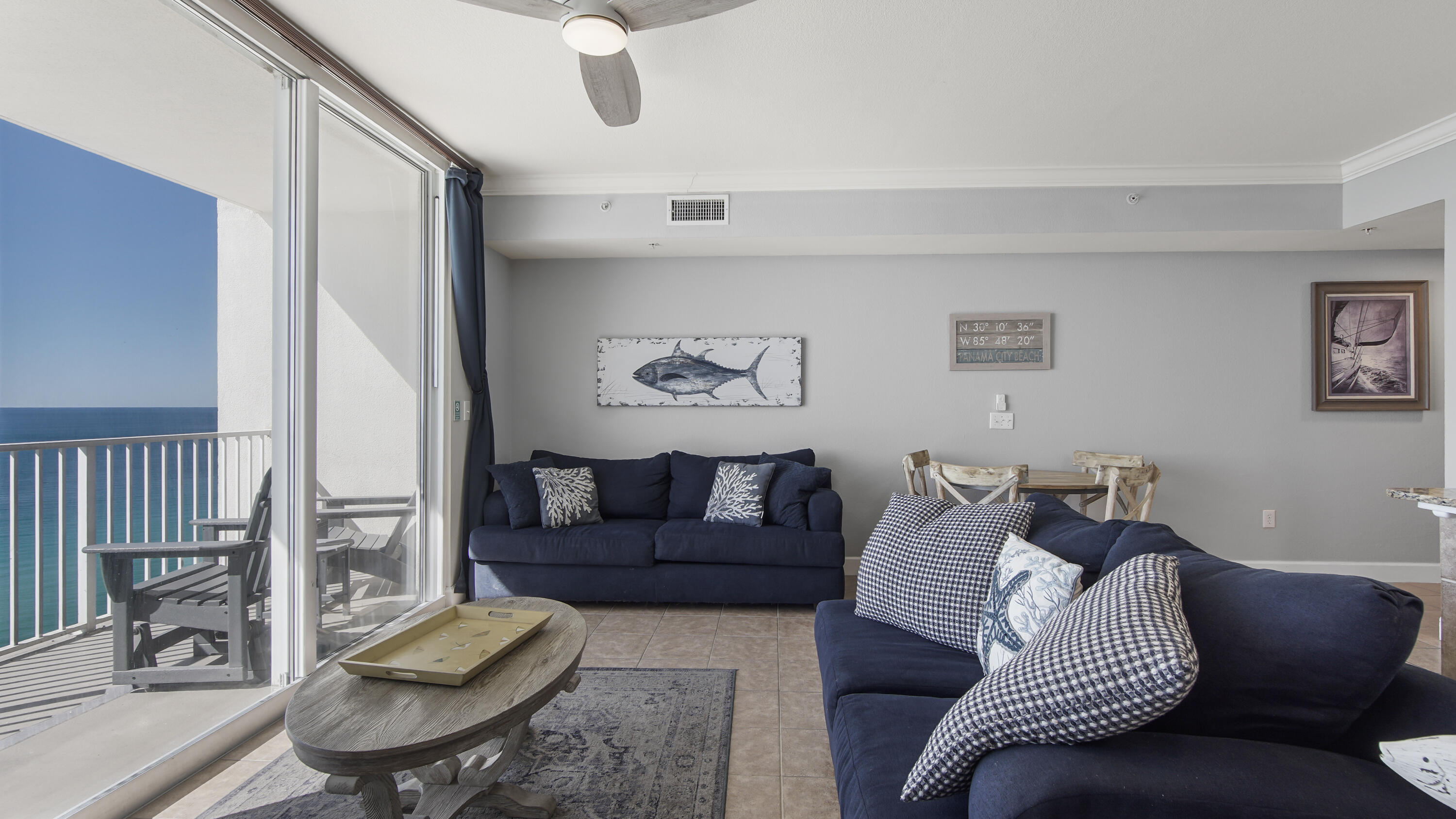 16819 Front Beach Road, Unit 1810 Panama City Beach, FL 32413 - Photo 44 of 54 a living room with furniture and a large window