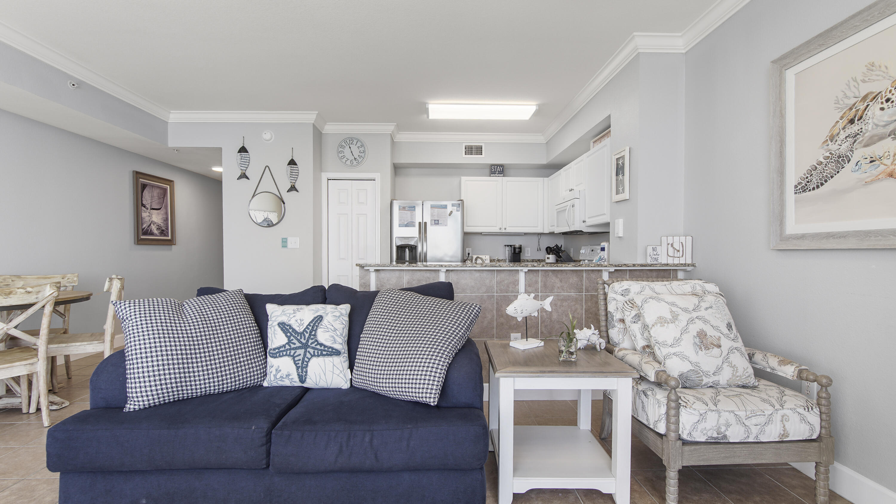 16819 Front Beach Road, Unit 1810 Panama City Beach, FL 32413 - Photo 45 of 54 a living room with furniture and kitchen view