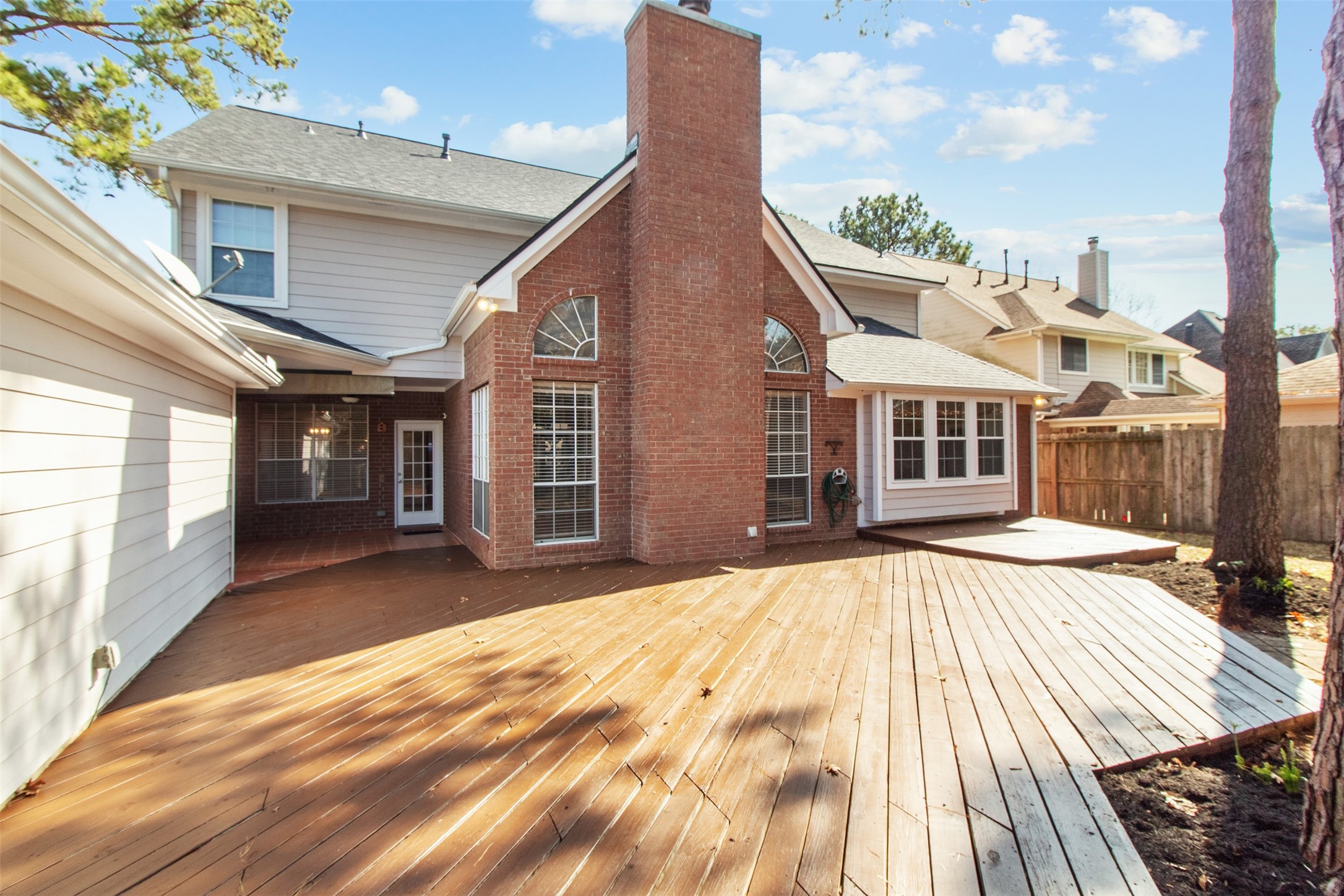 5127 Heathfield Court Houston, TX 77084 - Photo 33 of 37 An extended back deck is ready for your backyard BBQ's with friends and family.