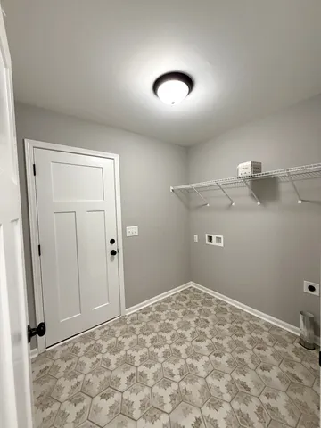 an empty room with a empty space and windows