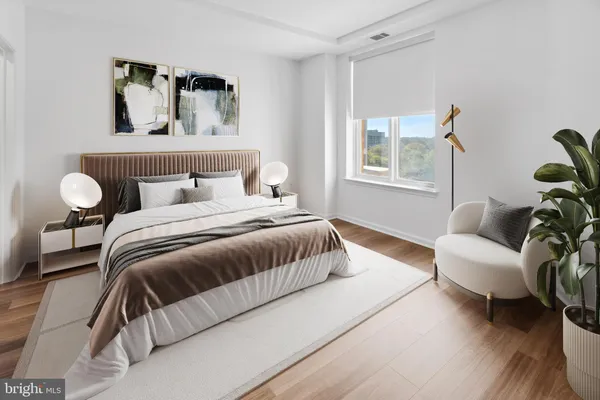a spacious bedroom with a bed and couch
