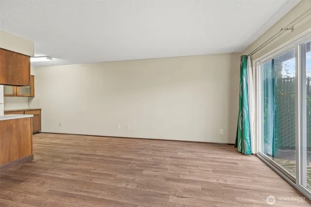 a kitchen with stainless steel appliances a refrigerator and a stove top oven