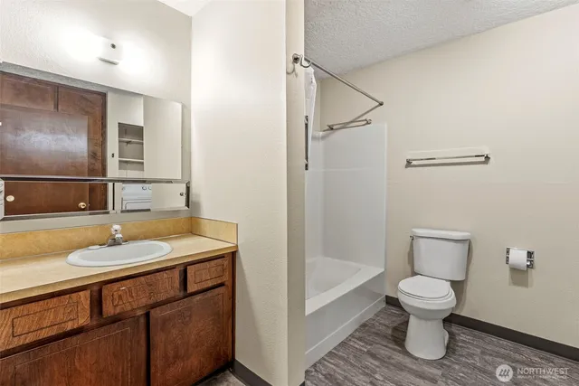 a bathroom with a toilet and a sink