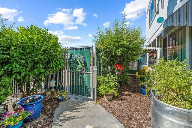 a view of a chair and tables in the garden