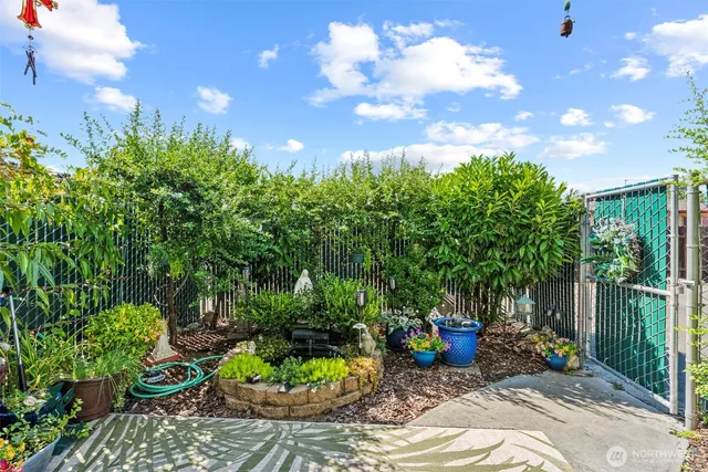 a view of a backyard with sitting area