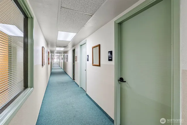 a living room with furniture a ceiling fan and a window