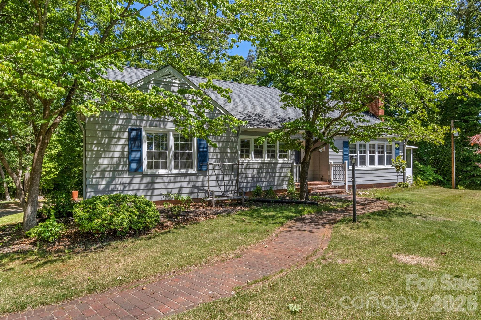 951 Dodson Mill Road Pilot Mountain, NC 27041 - Photo 2 of 48 a backyard of a house with lots of green space