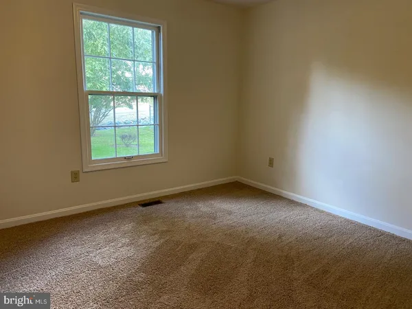 a view of house with a deck and furniture