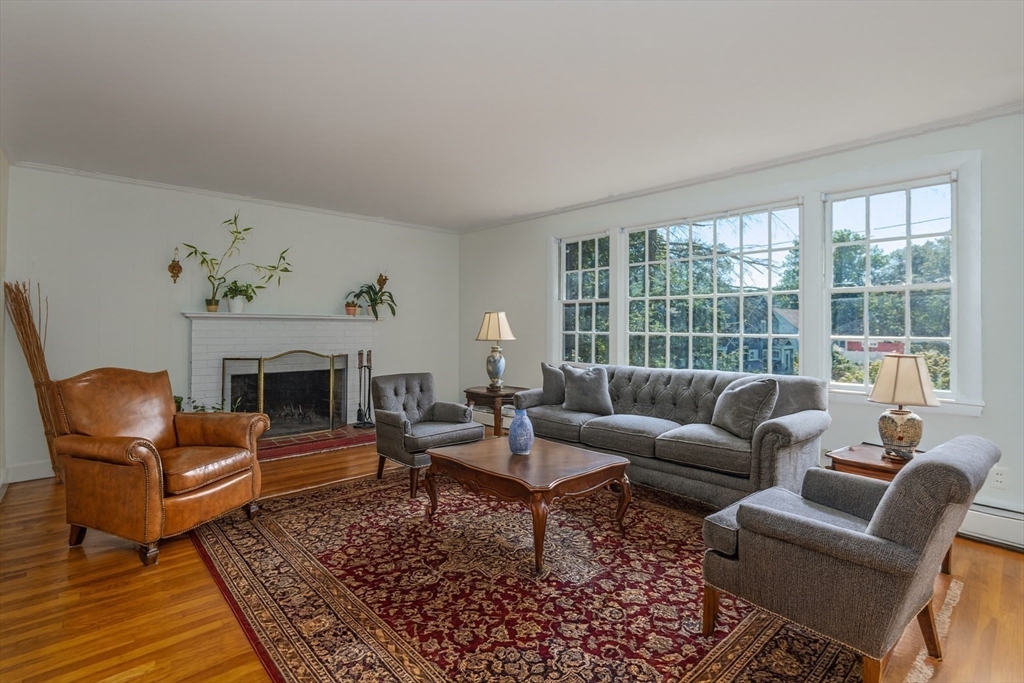 a living room with furniture windows and a fireplace